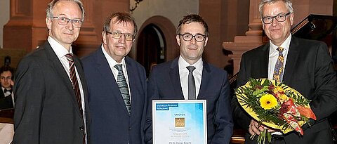 Laudator F. Würthner, President A. Forchel, F. Beuerle and the Chairman of the 'Universitätsbund', D. Brandstätter (f.l.t.r.; Photo: H. Becker)