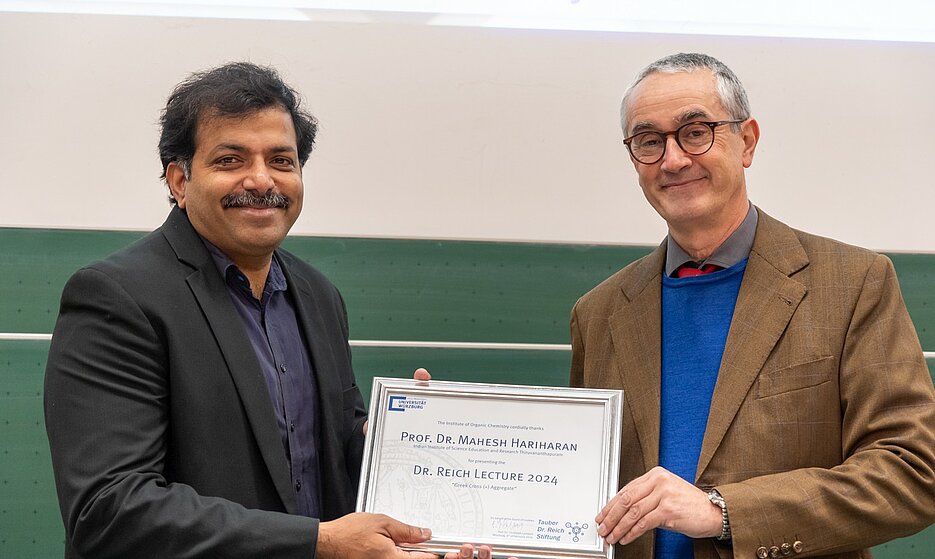 Prof. Mahesh Hariharan and Prof. Christoph Lambert with the certificate