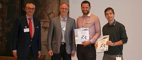 Posterprize winners (right to left: C. Henkel, B. Bohn) with Prof. F. Würthner and organizer Prof. C. Lambert (photo: A. Liess)