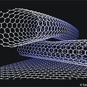 Ball and stick model of two crossing (10,10) tubes on a graphite surface.