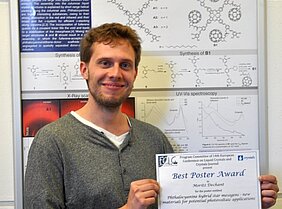 Moritz Dechant in front of his Poster