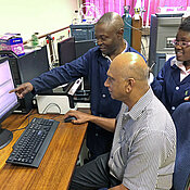 Professor Vinesh Maharaj with the two BEBUC scholarship recipients Séverin Muyisa and Séphora Mianda, also assisted by Gerhard Bringmann