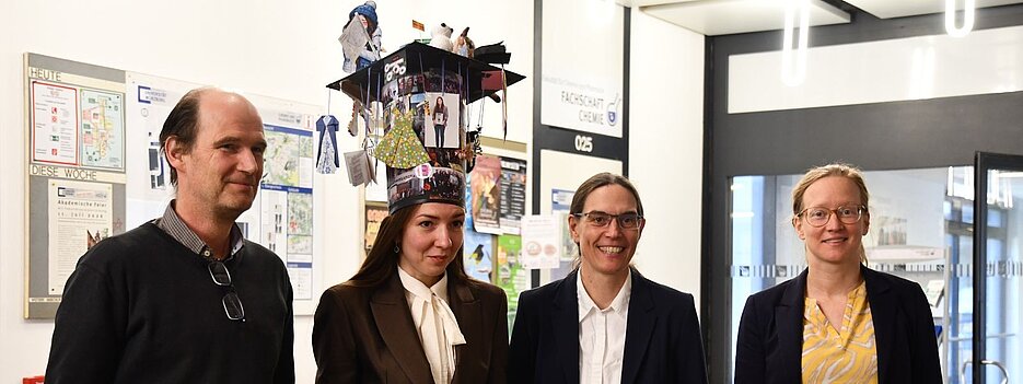 The examiners Prof. Utz Fischer, Prof. Claudia Höbartner (principal supervisor) and Prof. Ann-Christin Pöppler (from left to right) offer their congratulations to Dr Evgeniia Dorinova (second from the left)