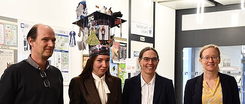The examiners Prof. Utz Fischer, Prof. Claudia Höbartner (principal supervisor) and Prof. Ann-Christin Pöppler (from left to right) offer their congratulations to Dr Evgeniia Dorinova (second from the left)