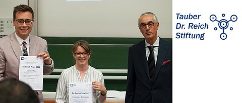 Leonard Fink and Franziska Schneider presenting their certificates, and laudatory speaker Christoph Lambert (photo: C. Stadler)