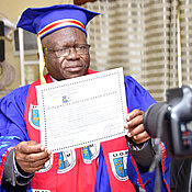 Presentation of Bringmann's h.c. diploma by the Rector, A. Mpoyi. (Photo: A. Mfwamba)